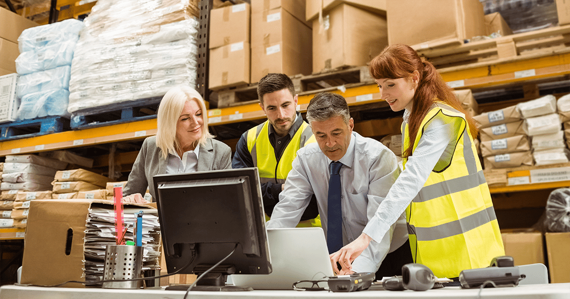 Employees in warehouse analyzing data