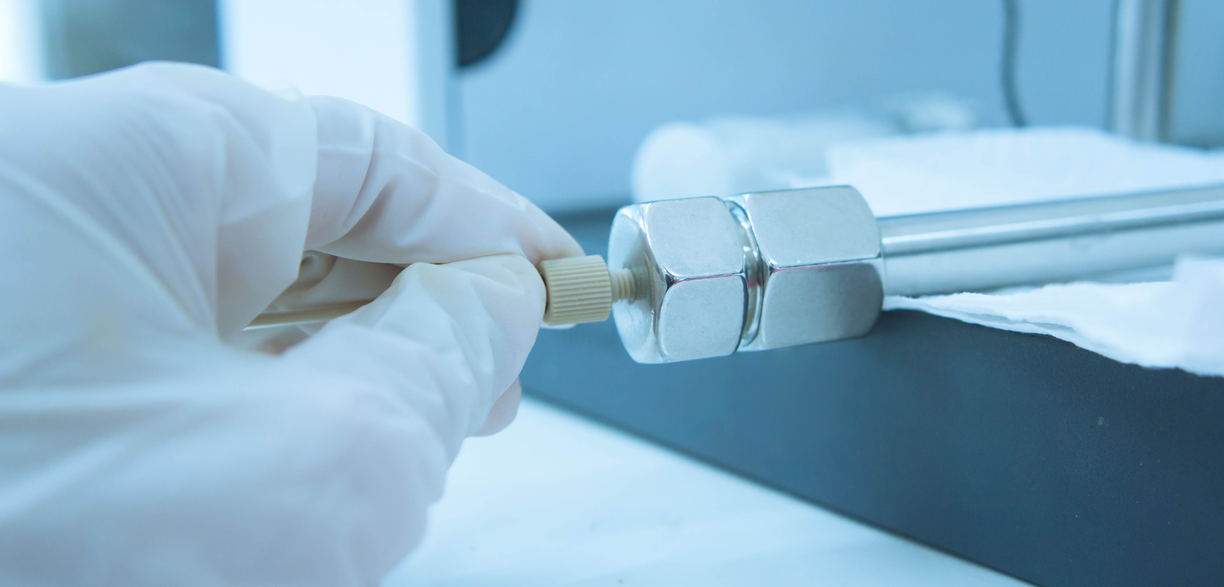 Technician installing pharmaceutical manufacturing equipment