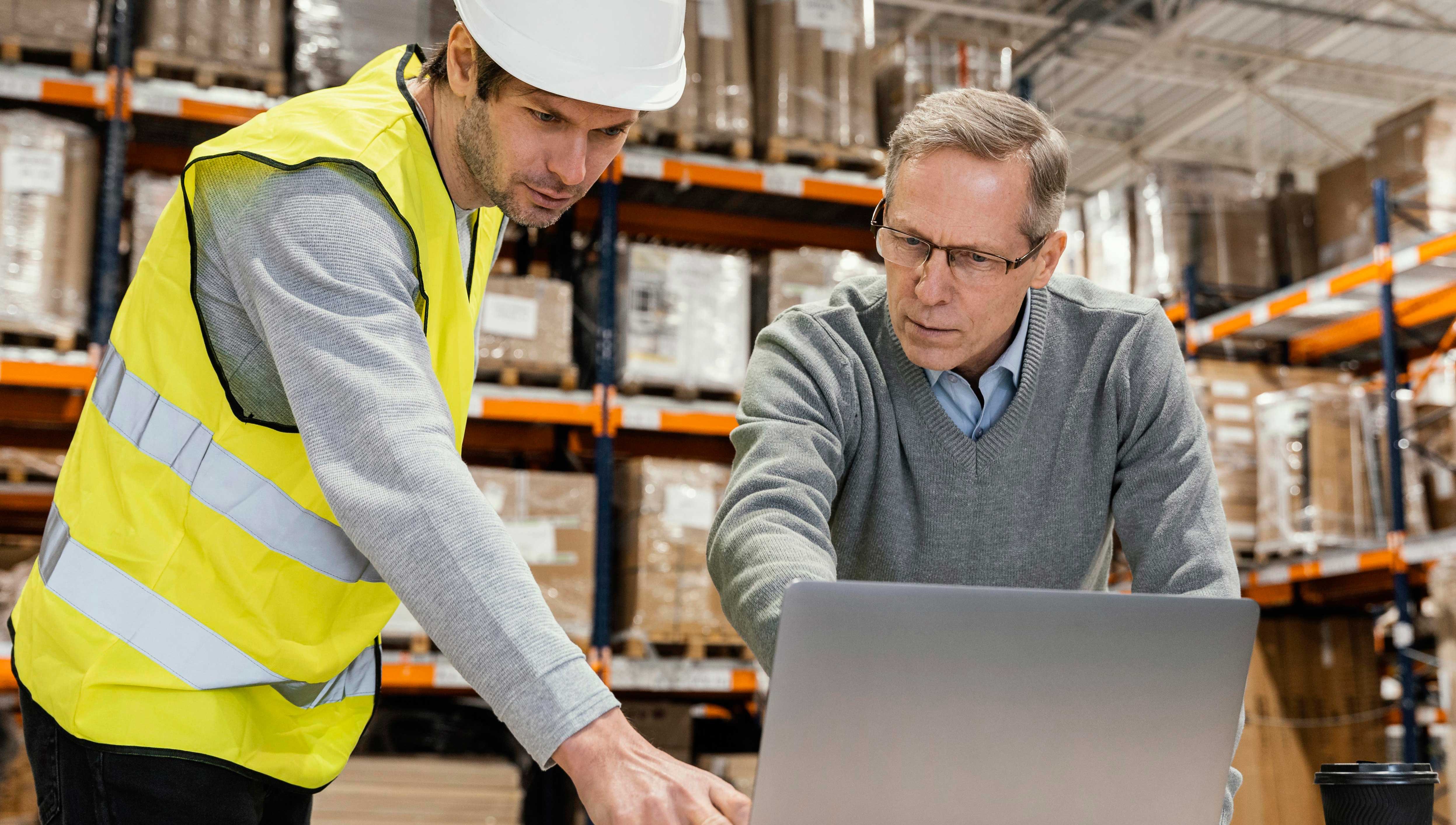 men-warehouse-working-laptop