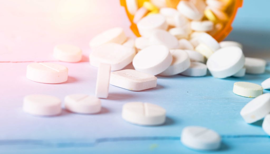 pills-with-orange-bottle-table