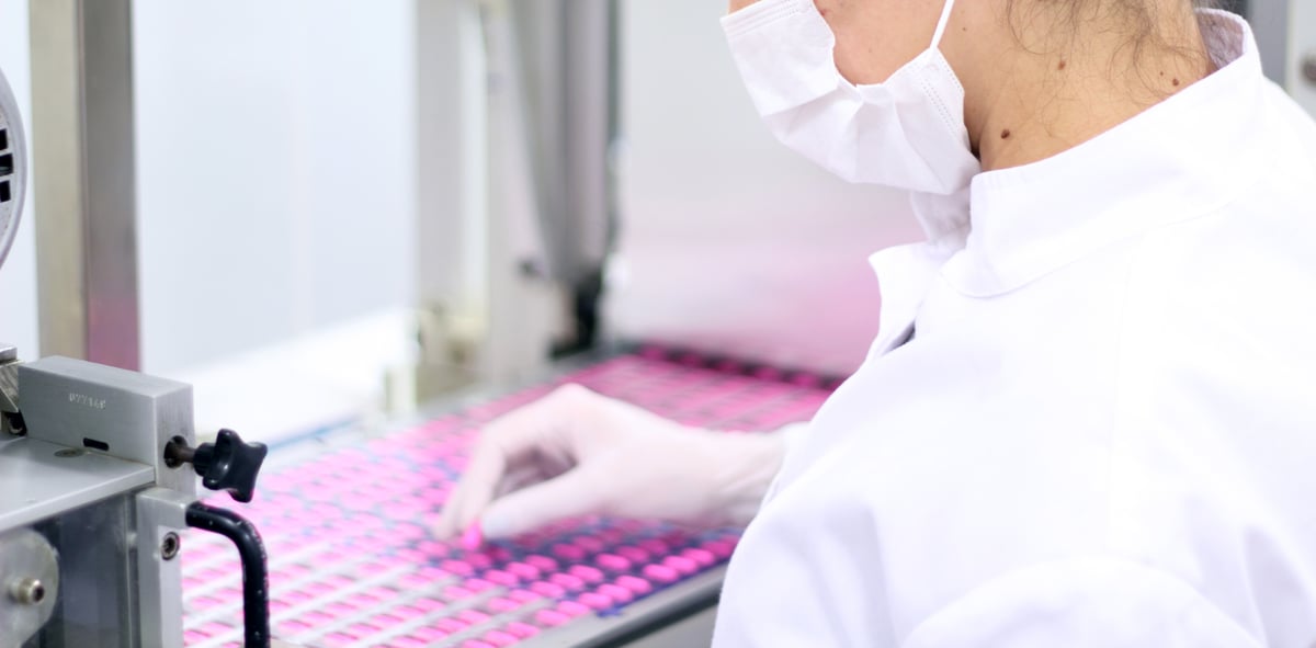 Woman working in pharmaceutical production