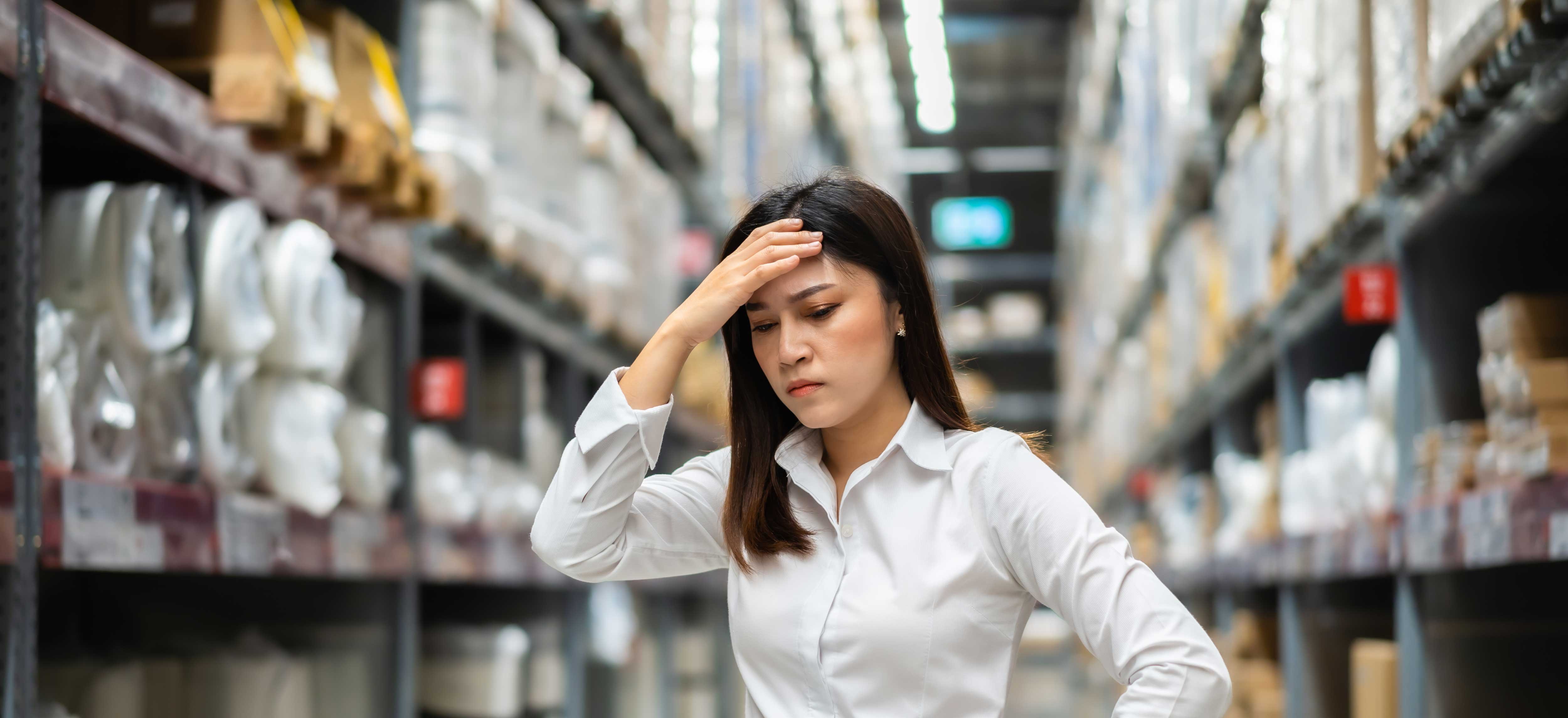 stressed-female-manager-warehouse-store